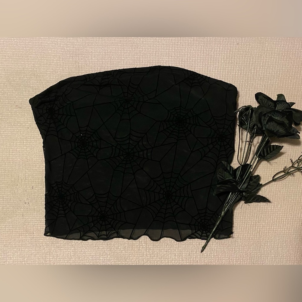 A spiderweb mesh tube top.